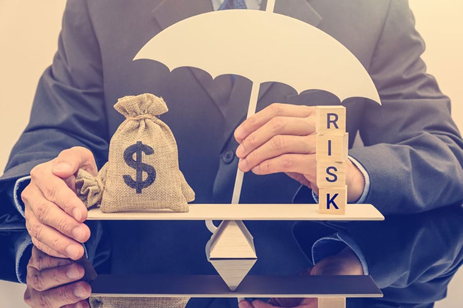 Balancing a pile of money against risks